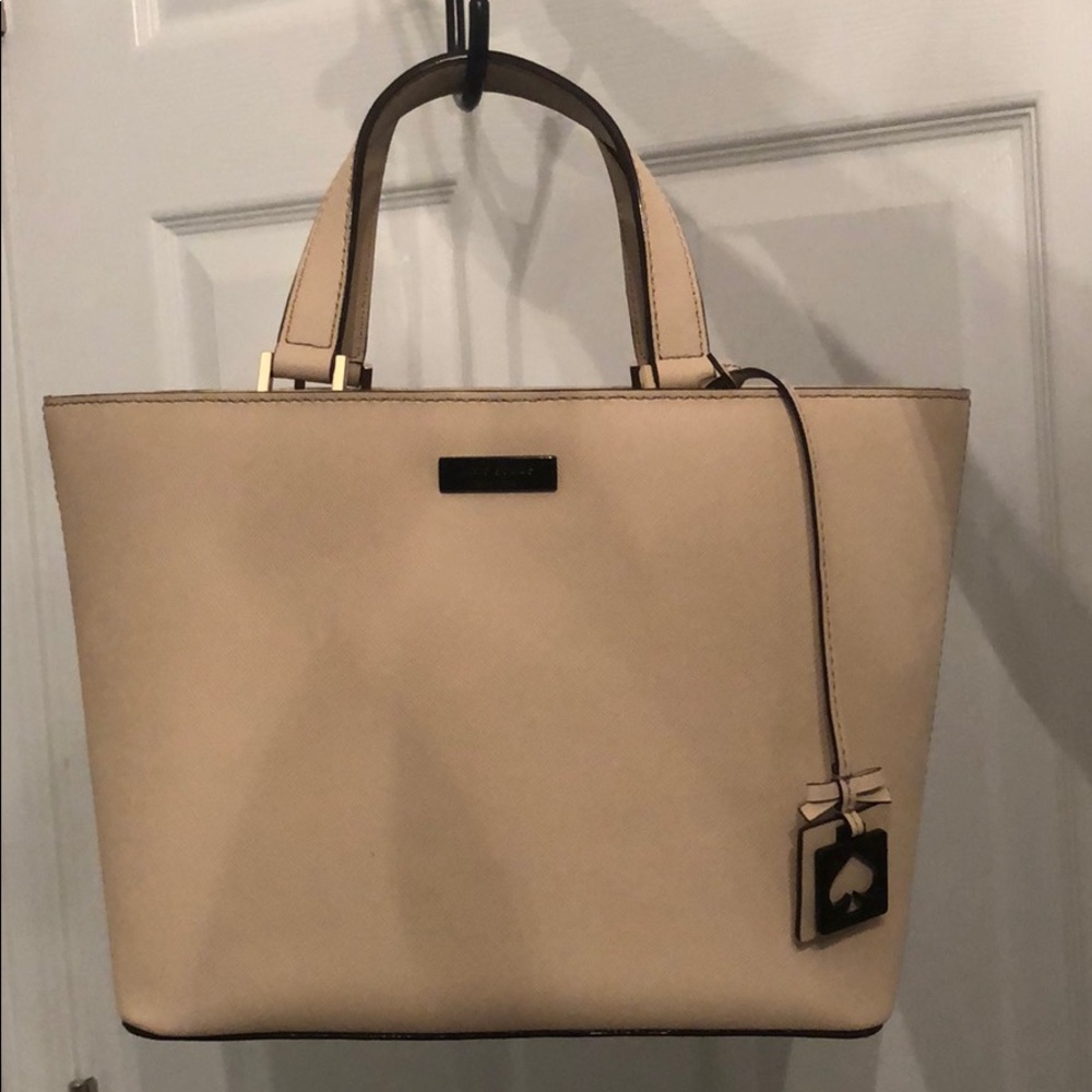 Kate Spade ivory tote 8 by 10 size